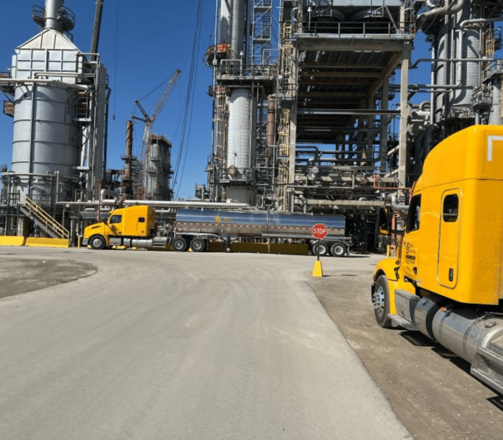 Transport Trucks Loading at a Chemical Refinery